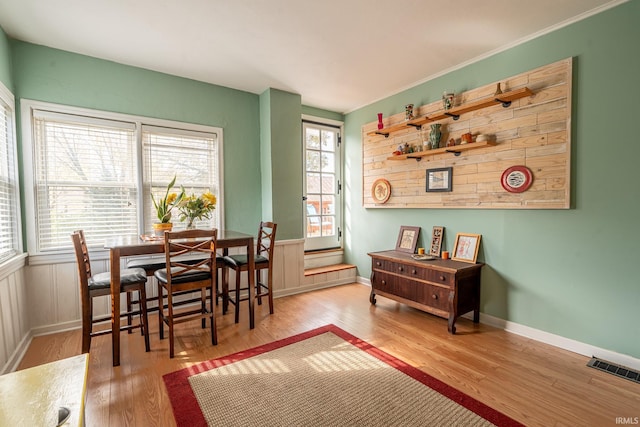 dining area featuring light hardwood / wood-style flooring and plenty of natural light