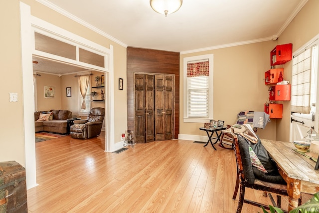 office area featuring crown molding and light hardwood / wood-style flooring