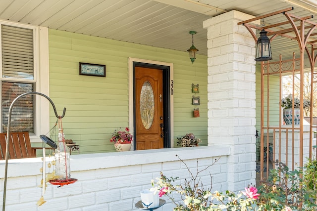 doorway to property with a porch