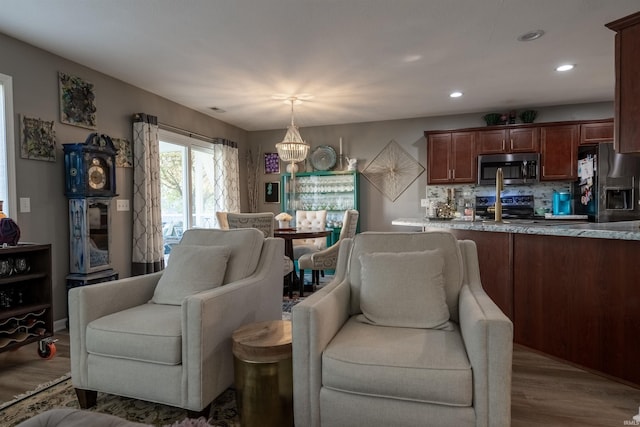 interior space featuring hardwood / wood-style flooring and a chandelier