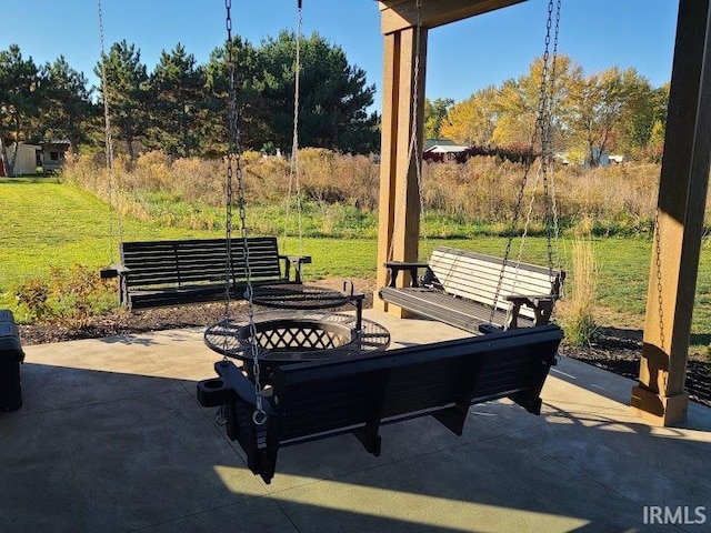 view of patio with an outdoor fire pit