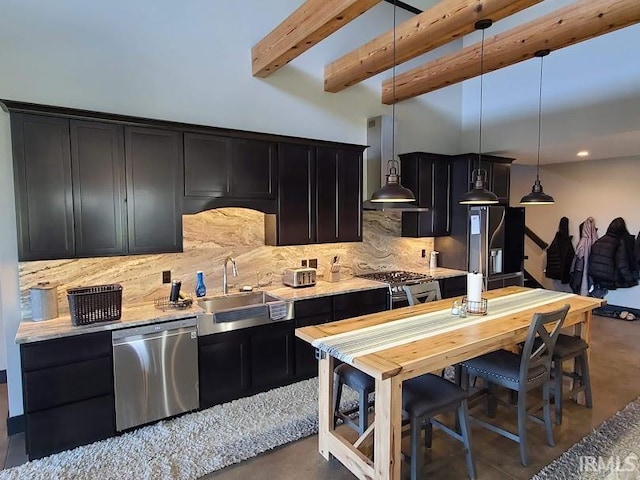 kitchen with decorative backsplash, ventilation hood, sink, decorative light fixtures, and appliances with stainless steel finishes