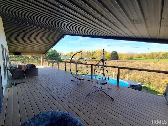 deck with a fenced in pool