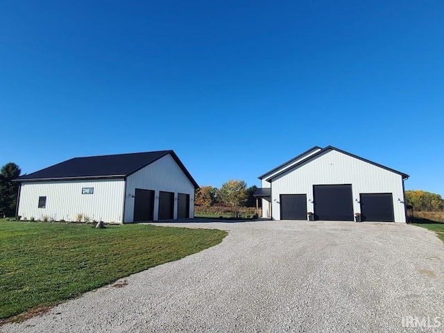 exterior space featuring a yard and a garage