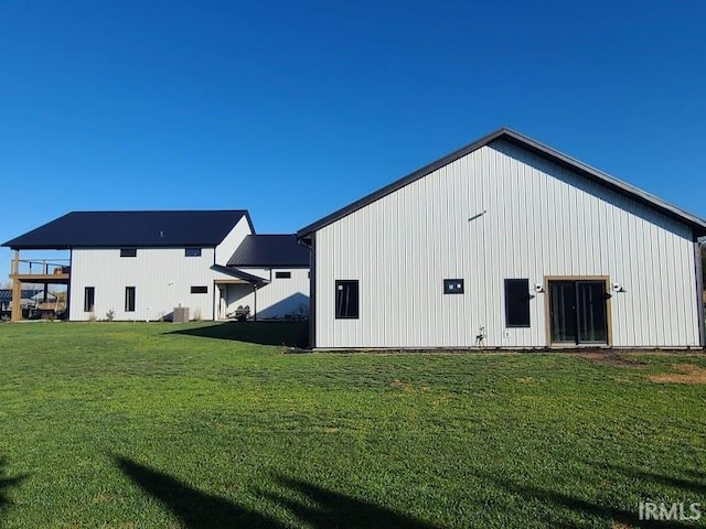 view of outbuilding with a lawn