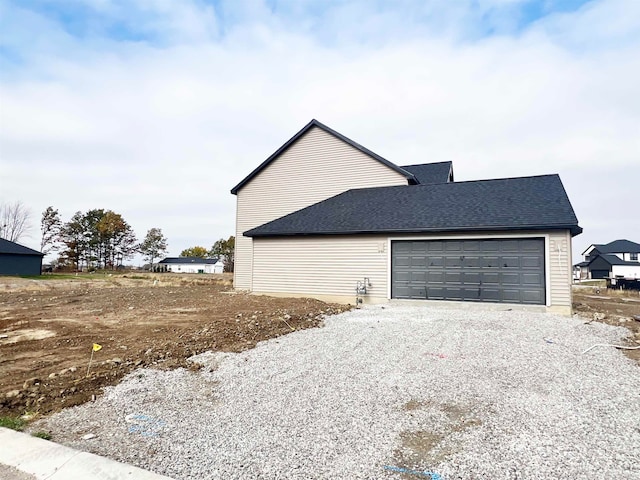 view of side of property featuring a garage