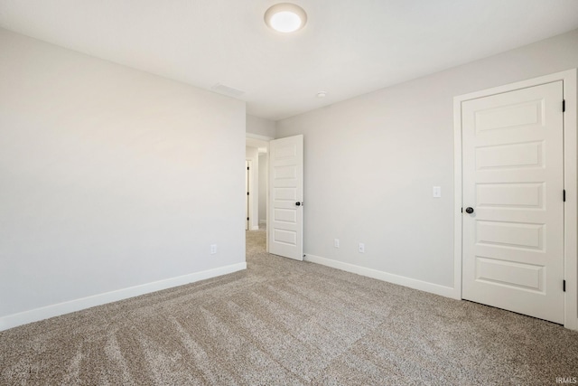 unfurnished room featuring carpet floors