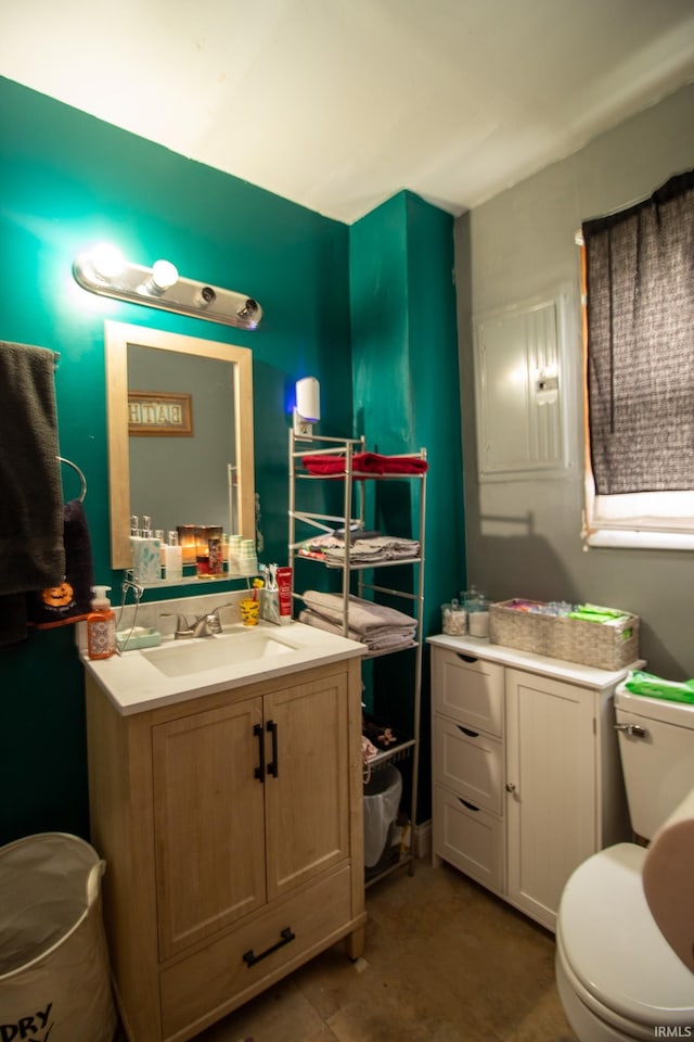 bathroom featuring toilet and vanity