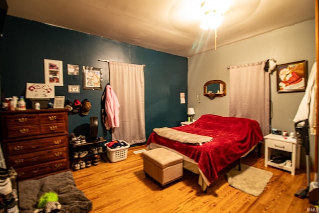 bedroom with hardwood / wood-style floors