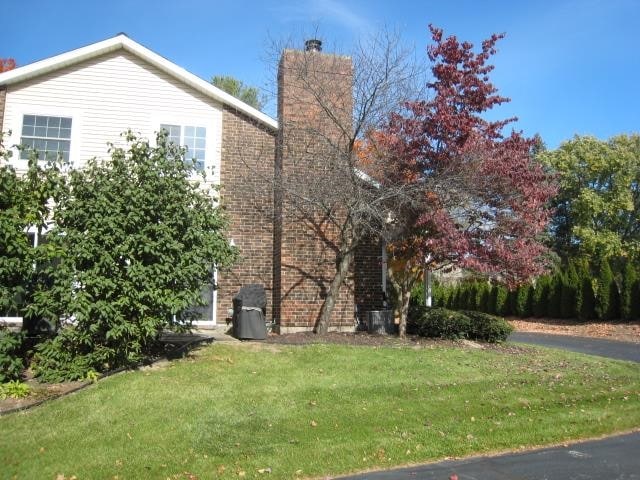 view of property exterior featuring a yard