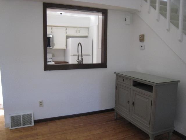 interior space with dark hardwood / wood-style floors