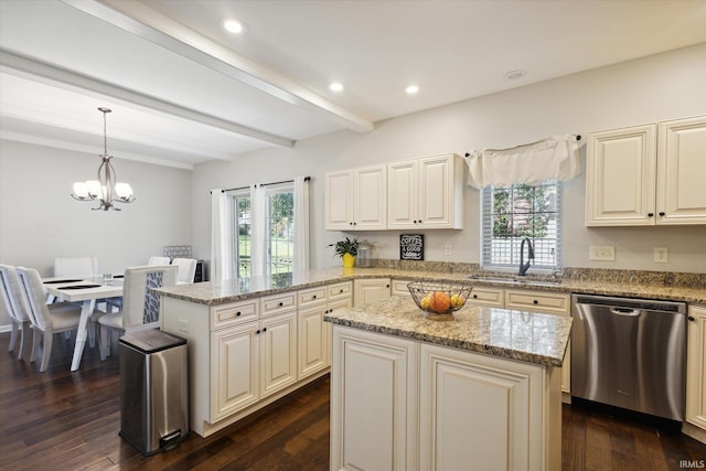 kitchen featuring a center island, a healthy amount of sunlight, dishwasher, and hanging light fixtures