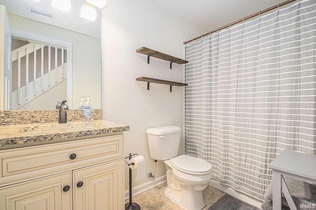 bathroom featuring vanity, curtained shower, toilet, and tile patterned flooring