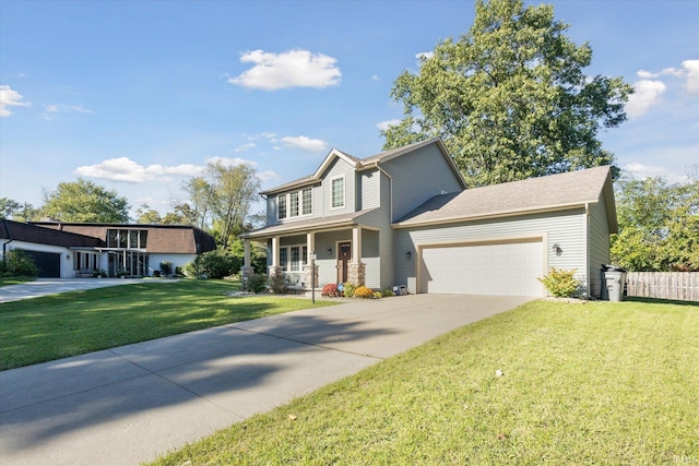 view of front of property with a front yard, a garage, and covered porch