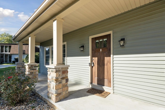 doorway to property with a porch