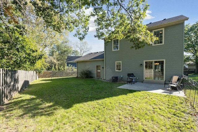 back of property featuring cooling unit, a patio area, and a lawn