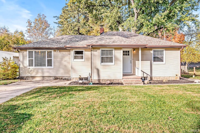 ranch-style home with a front lawn