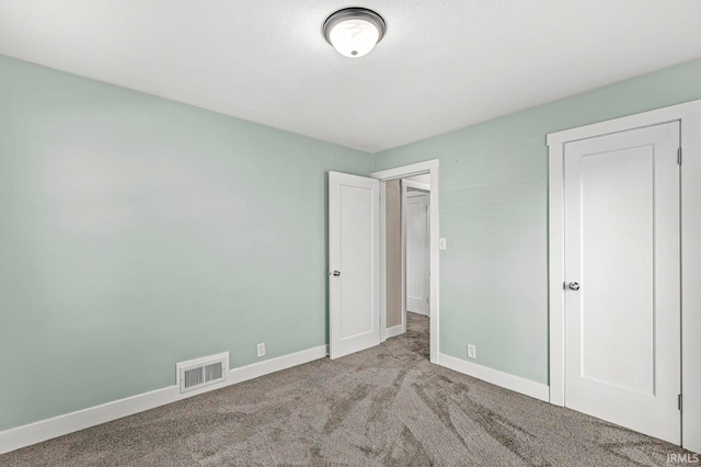 unfurnished bedroom featuring light colored carpet