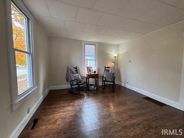 unfurnished room featuring dark wood-type flooring