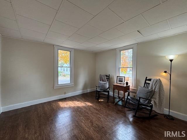 sitting room with dark hardwood / wood-style floors and a wealth of natural light