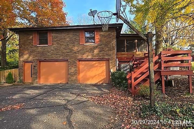 rear view of house with a garage