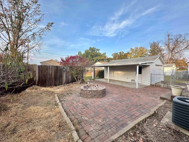 view of patio featuring an outdoor fire pit and cooling unit