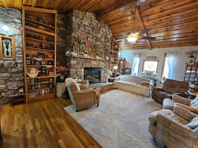 living room featuring wood-type flooring, vaulted ceiling with beams, a fireplace, wood ceiling, and ceiling fan