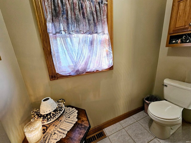 bathroom featuring toilet and tile patterned floors