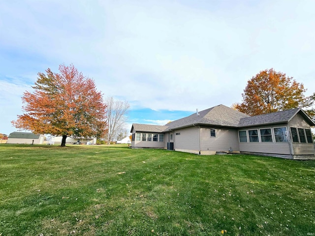 view of property exterior with a lawn