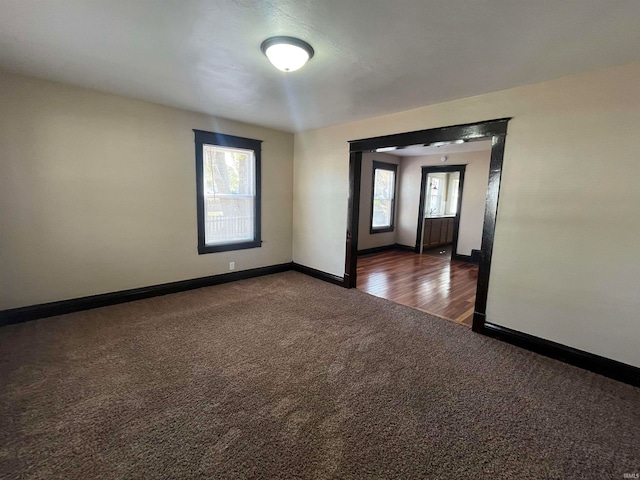 spare room featuring dark hardwood / wood-style floors