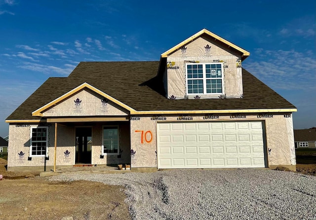 property under construction with a porch and a garage