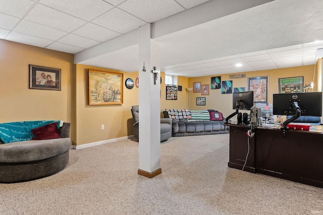 carpeted home office featuring a paneled ceiling