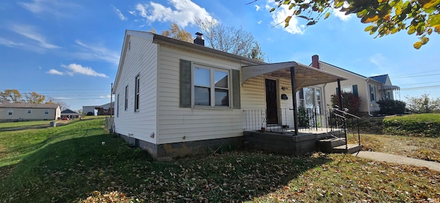 bungalow-style home featuring a front yard