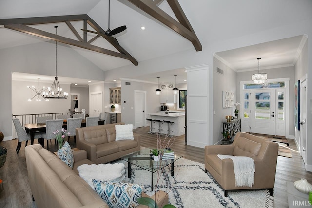 living room featuring crown molding, beam ceiling, hardwood / wood-style flooring, and high vaulted ceiling