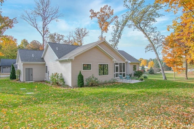 back of house featuring a patio and a yard