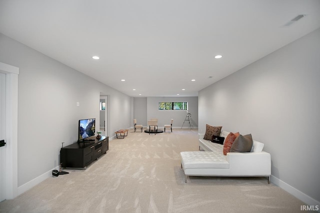 living room featuring light carpet