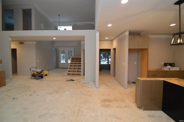 interior space featuring hanging light fixtures and french doors