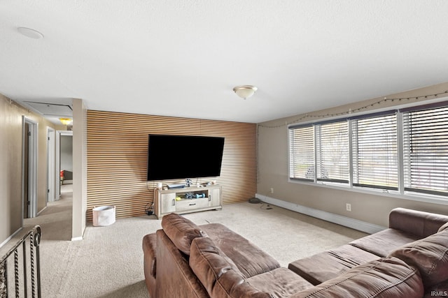 carpeted living room with a textured ceiling