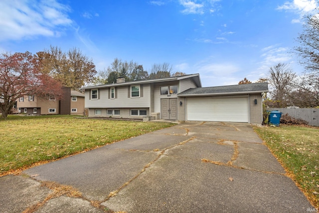 view of front facade featuring a front yard and a garage