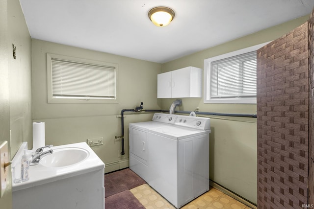 laundry room featuring sink and separate washer and dryer