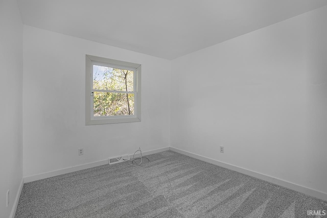 empty room featuring carpet floors