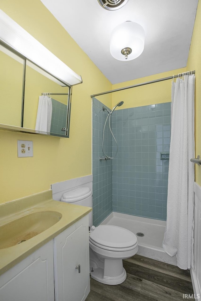 bathroom with vanity, toilet, walk in shower, and wood-type flooring