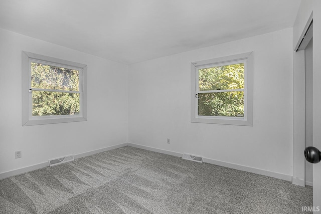 spare room featuring carpet flooring