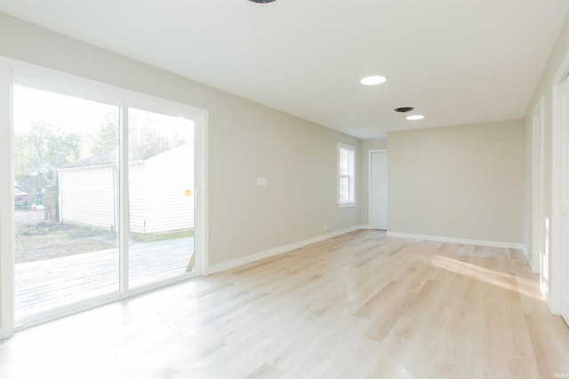 unfurnished room featuring light hardwood / wood-style flooring