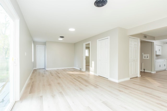 spare room with light hardwood / wood-style floors