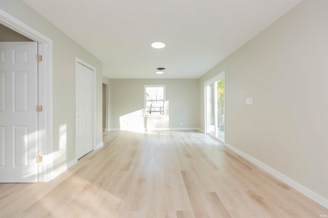 spare room featuring light hardwood / wood-style flooring