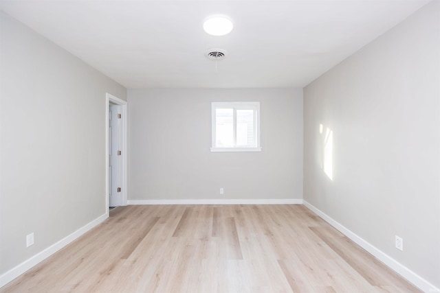 unfurnished room featuring light wood-type flooring