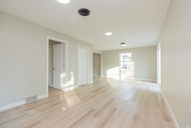 spare room featuring light wood-type flooring