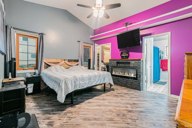 bedroom featuring ceiling fan, wood-type flooring, and vaulted ceiling