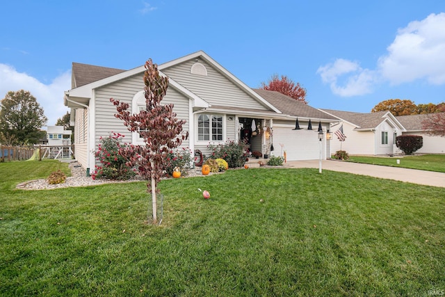 view of front of property featuring a front yard and a garage